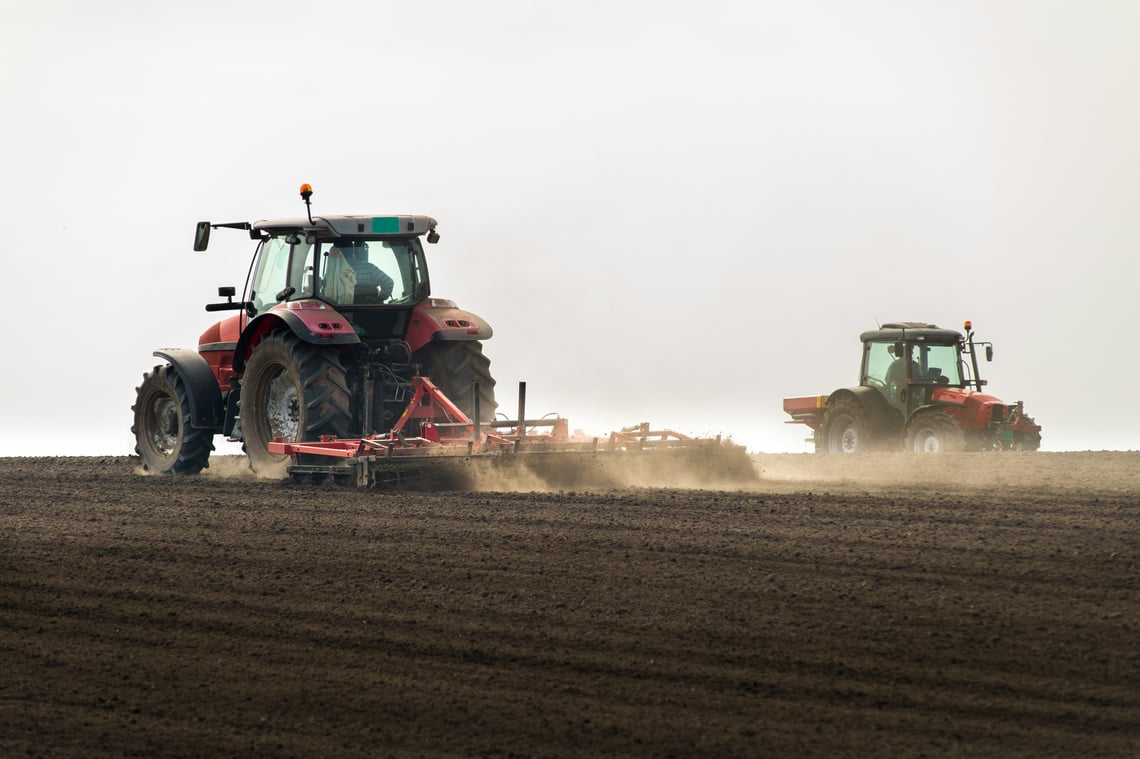 Tractors preparing land